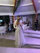 Bride In Long Sleeve Lace Wedding Dress Called Iris By Rebecca Ingram With Groom At Reception