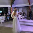 Bride In Long Sleeve Lace Wedding Dress Called Iris By Rebecca Ingram With Groom At Reception