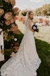 Bride Wearing Square Neck Long Sleeve Floral Wedding Dress Called Sawyer By Sottero And Midgley With Long Veil