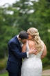 Groom Kissing Bride. Bride Wearing Low Back Beaded Wedding Dress Called Elaine By Maggie Sottero