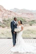 Bride with groom wearing off the shoulder lace wedding dress