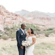 Bride with groom wearing off the shoulder lace wedding dress