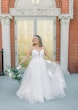 Bride wearing Hattie Lane Marie wedding dress by Rebecca Ingram