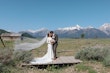 Bride wearing Aston by Sottero and Midgley kissing her husband