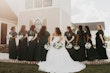 Bride Wearing Sparkly Ballgown Wedding Dress Called Zartasha By Sottero and Midgley With Her Bridesmaids