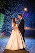 Bride Wearing Simple Ballgown Wedding Dress Called Fortune By Maggie Sottero With Shining Lights Behind Them