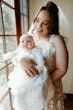 Bride Wearing Lace Wedding Dress Called Ladonna By Maggie Sottero Holding Baby