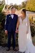 Bride wearing Hamilton wedding dress by Sottero and Midgley holding hands with her husband