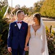 Bride wearing Hamilton wedding dress by Sottero and Midgley holding hands with her husband