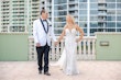 Bride Wearing Lace Mermaid Wedding Dress Called Bronson By Sottero And Midgley Holding Hands With Groom