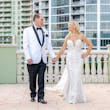 Bride Wearing Lace Mermaid Wedding Dress Called Bronson By Sottero And Midgley Holding Hands With Groom