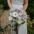 Bride wearing Lorraine by Rebecca Ingram and her bouquet