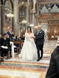 Bride Wearing Glam Long Sleeve Wedding Dress Called Seneca By Sottero And Midgley Walking Down the Aisle With Groom