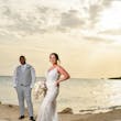 Bride wearing Franklynn by Sottero and Midgley with her husband on the beach