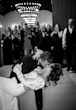 Groom Kissing Bride In A White Long Sleeve Wedding Dress Named Nikki By Maggie Sottero