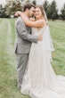 Groom With Bride Wearing Boho-Chic A-line Wedding Dress Courtney By Rebecca Ingram