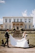 Groom With Bride Wearing Mikado A-Line Wedding Dress Raven By Maggie Sottero