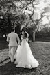 Bride wearing Lettie by Rebecca Ingram walking with her husband