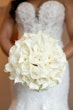 Bride Wearing Sexy Lace Wedding Dress Called Lennon By Maggie Sottero With A White Rose Bouquet