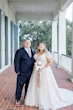 Groom with Bride Wearing A-Line Wedding Dress Called Wallis by Maggie Sottero