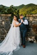 Bride Wearing Shimmery Princess Bridal Gown Called Tiffany By Maggie Sottero Posing With Groom