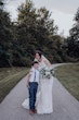 Bride wearing budget friendly fit and flare wedding dress