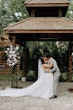 Bride Wearing A-Line Romantic Wedding Dress Called Marlow By Sottero And Midgley Kissing Groom Under Gazebo