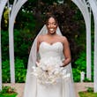 Bride Wearing Simple Fit and Flare Wedding Dress Called Anniston Lane With A White Bouquet