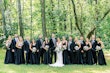 Bride wearing simple crepe wedding dress Bertina by Maggie Sottero.