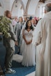 Bride wearing Lorraine by Rebecca Ingram during her ceremony