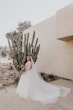 Bride Showing Off Long Tulle Train. Bride Wearing Romantic Long Sleeve Ball Gown Called Mallory Dawn By Maggie Sottero 