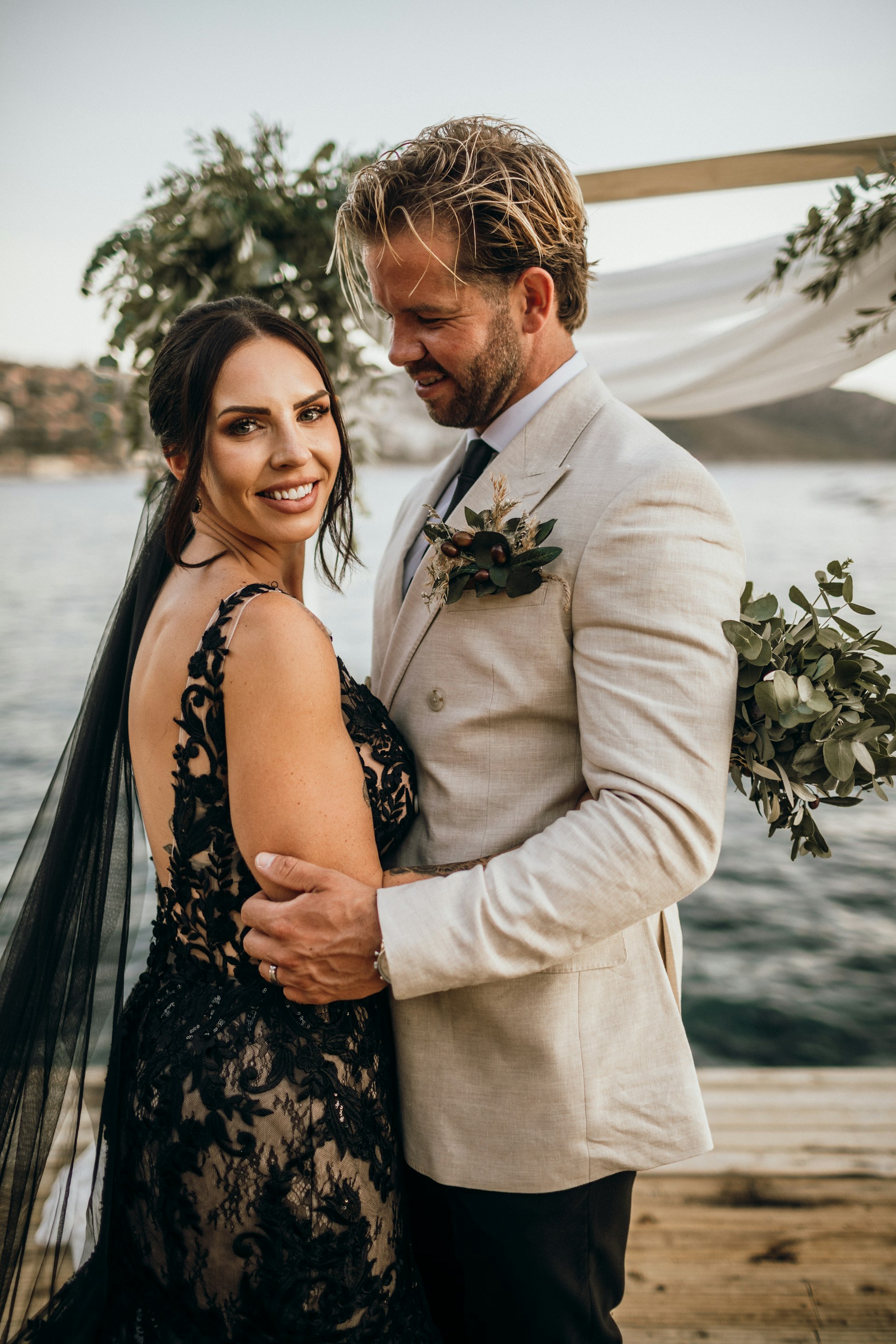 Bride Wearing Black Fit And Flare Wedding Dress Called Zander Lane By Sottero And Midgley With Groom