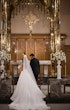 Bride wearing Barcelona by Sottero and Midgley walking with her husband