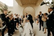 Bride wearing Tristyn wedding dress by Maggie Sottero kissing her husband