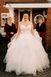 Bride In Tiered Ballgown Yasmin Maggie Sottero With Bridesmaids in Red