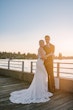 Bride Wearing Beaded Wedding Dress Called Luella By Sottero And Midgley With Groom On A Pier