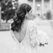 Black And White Image Of Bride Wearing Long Sleeve Lace Wedding Dress Called Cruz By Sotero And Midgley