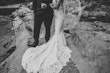 Brides train cascading over rocks.