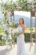 Bride Wearing Lace Fit-n-flare Wedding Dress Called Nyjah By Sottero And Midgley Holding White Floral Bouquet