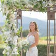 Bride Wearing Lace Fit-n-flare Wedding Dress Called Nyjah By Sottero And Midgley Holding White Floral Bouquet