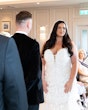 Bride in glamorous beaded wedding dress called Alistaire by Maggie Sottero with groom