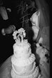 Bride wearing Saratoga by Maggie Sottero with her wedding cake