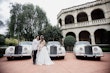 Bride Wearing Princess Ballgown Wedding Dress Called Kimora By Sottero And Midgley With Groom And 3 Vintage Cars