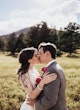 Bride Wearing Sexy Lace Wedding Dress Called Hazel By Rebecca Ingram Kissing Groom