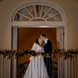 Bride wearing Seneca wedding dress by Sottero and Midgley kissing her husband