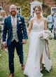 Bride wearing Lorraine by Rebecca Ingram and exiting her ceremony with her husband