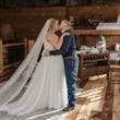 Bride In Chiffon Wedding Dress Called Tasha By Rebecca Ingram With Groom
