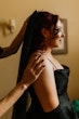 Bride Wearing Black Aline Wedding Dress Called Scarlet By Maggie Sottero Putting On Her Veil