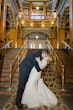 Bride wearing Riviera by Sottero and Midgley kissing her husband