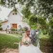 Groom and Bride at an Outdoor Wedding Wearing Lace Ballgown Wedding Dress Called Olivia by Rebecca Ingram